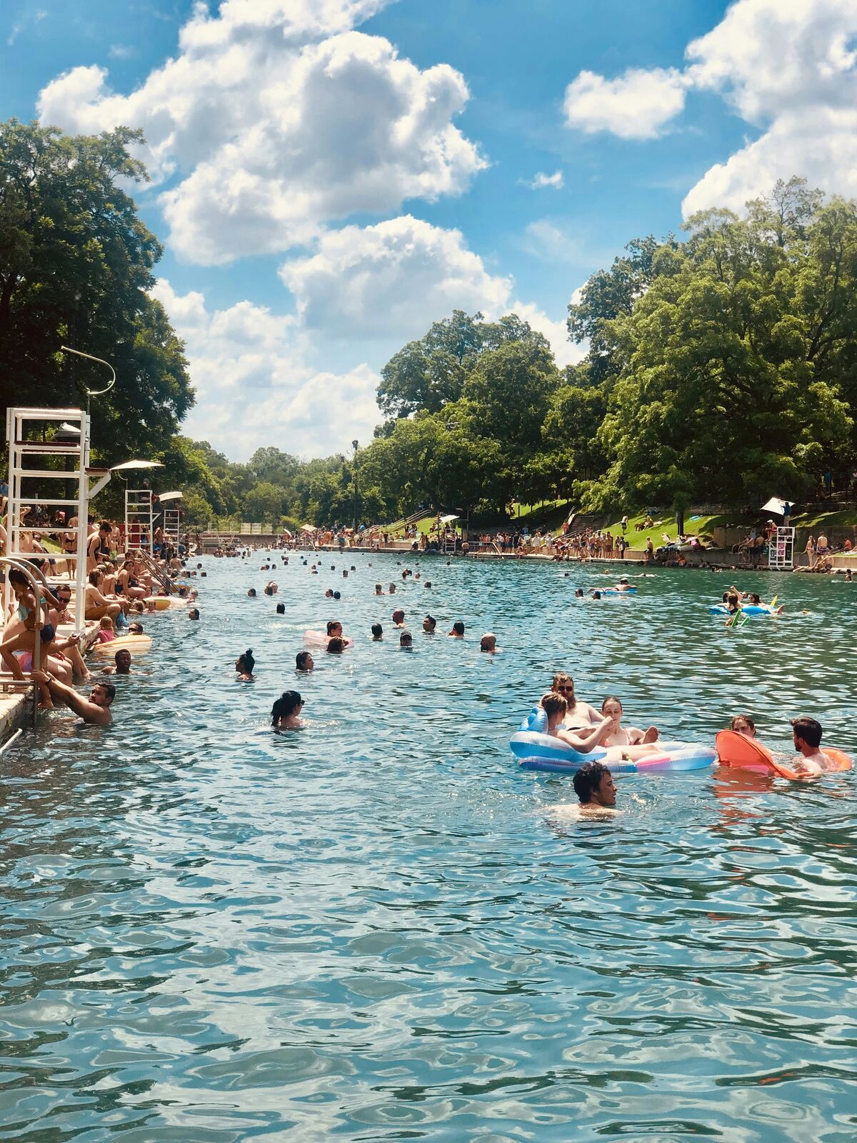 Swimmers and floats at Barton Springs Pool